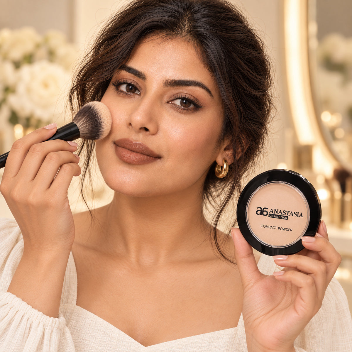 Model applying Anastasia Compact Powder with brush